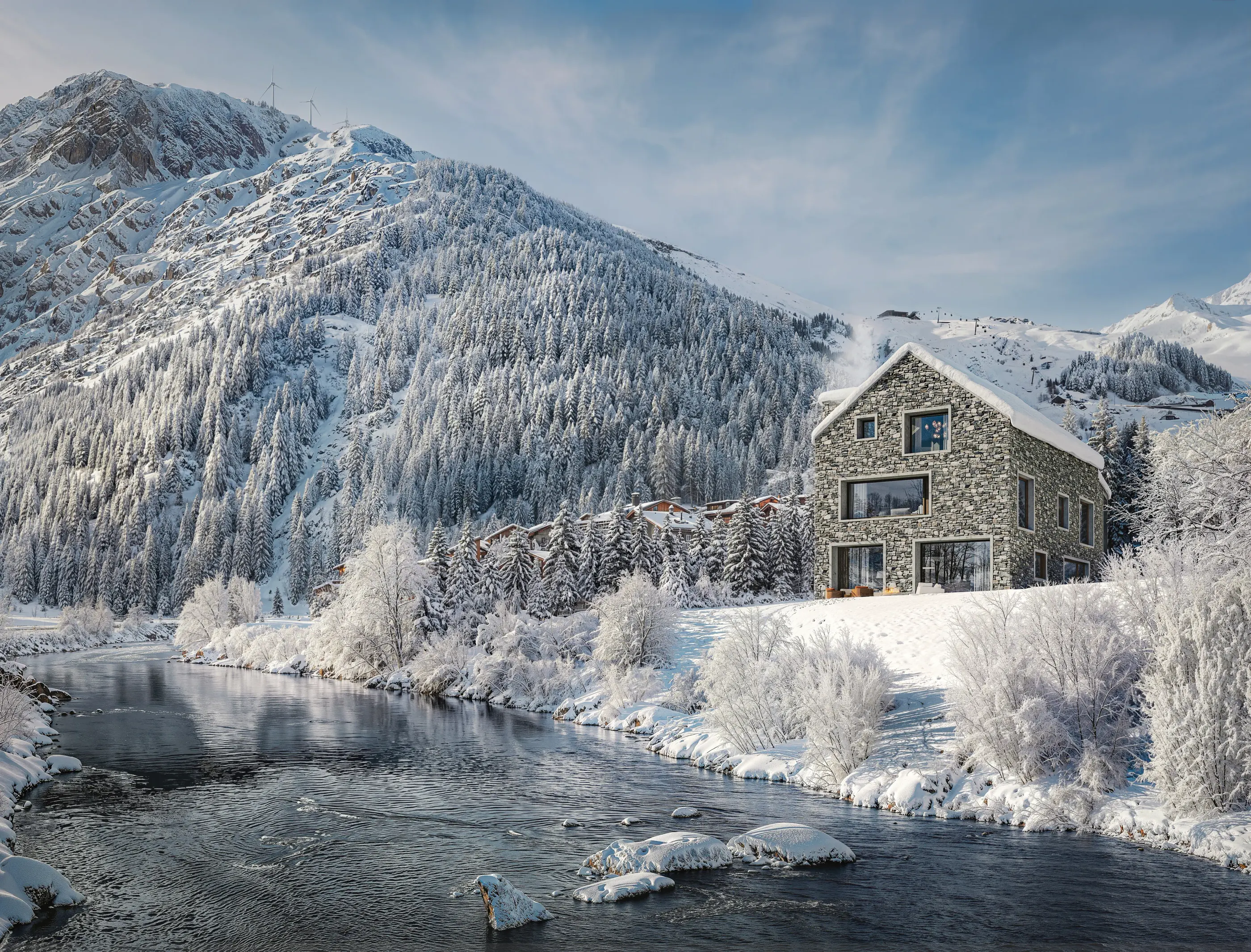 The River Reuss running past snow-covered trees and villas in Andermatt